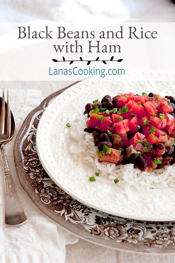 Black Beans and Rice with Ham - classic black beans and rice with the addition of tomatoes and ham. Garnished with fresh chopped tomatoes and chives.  https://www.lanascooking.com/black-beans-and-rice-with-ham/