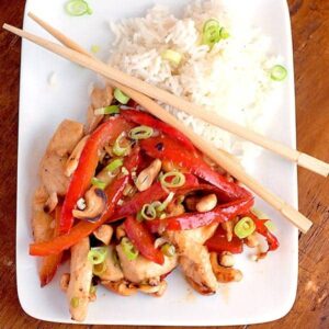 Cashew Chicken and Red Pepper Stir Fry - a quick cashew chicken stir fry that goes from prep to your table in under 30 minutes. https://www.lanascooking.com/cashew-chicken-stir-fry-with-red-peppers/