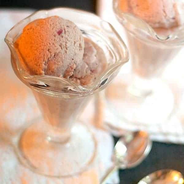 Rich, decadent, homemade strawberry ice cream. A summer time treat! https://www.lanascooking.com/homemade-strawberry-ice-cream/