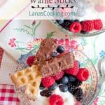 Chocolate Caramel Dipped Waffle Sticks with Fresh Berries and Cream - this recipe uses purchased frosting to make chocolate caramel dipped waffle sticks. https://www.lanascooking.com/chocolate-caramel-dipped-waffle-sticks-fresh-berries-cream/