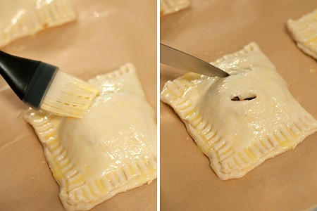 Applying egg wash to filled hand pies.