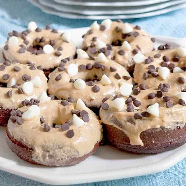 Baked Chocolate Doughnuts with Peanut Butter Frosting. Cut out the frying and reduce the calories with these baked chocolate doughnuts. https://www.lanascooking.com/baked-chocolate-doughnuts-peanut-butter-frosting/