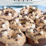 Baked Chocolate Doughnuts with Peanut Butter Frosting. Cut out the frying and reduce the calories with these baked chocolate doughnuts. https://www.lanascooking.com/baked-chocolate-doughnuts-peanut-butter-frosting/