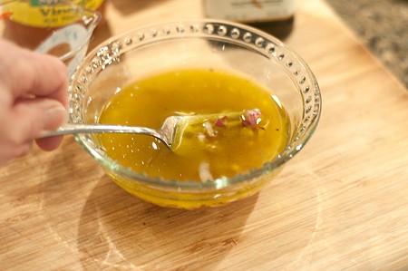 Mixing the shallot vinaigrette in a small bowl.