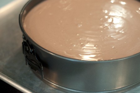 Cheesecake filling added to springform pan.