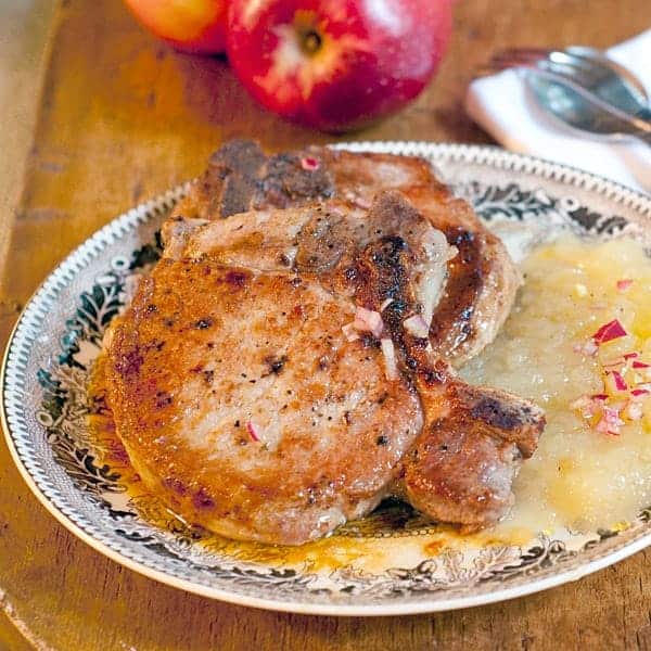 Pork Chops with Apple Puree - Perfectly pan-seared pork chops with apple puree topped with shallot vinaigrette. Great for a casual dinner party. https://www.lanascooking.com/pork-chops-apple-puree