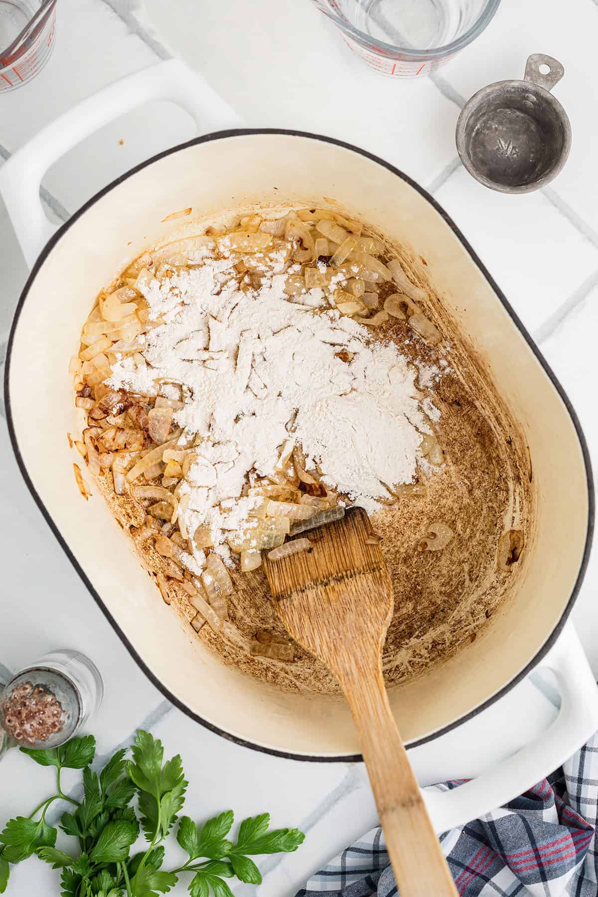 Flour added to cooked onions.