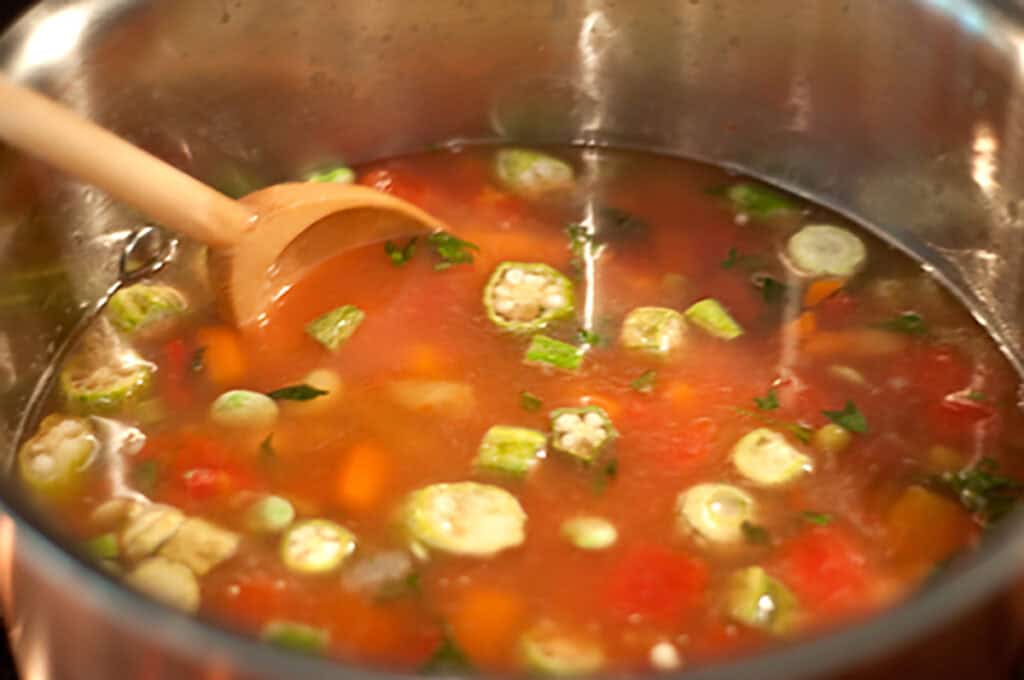 Vegetables and broth added to the pot.