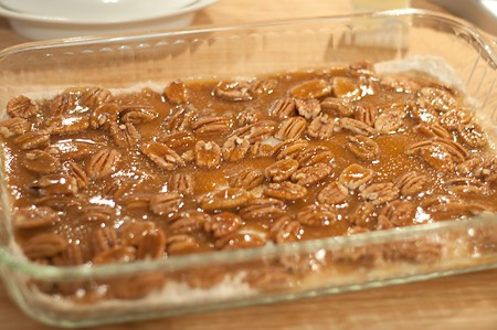 Carmel poured over pecans and crust in baking dish.