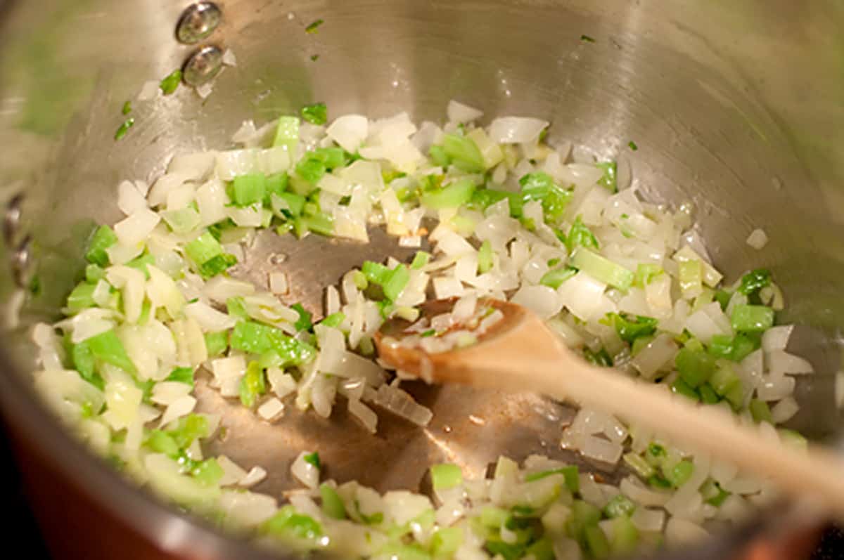 Aromatic vegetables cooking in a saucepan.