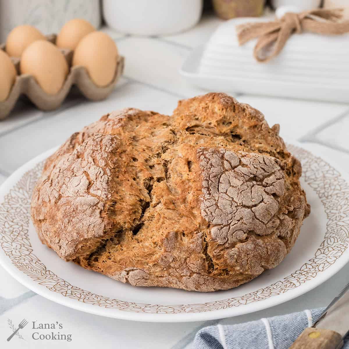 A loaf of soda bread on a plate.