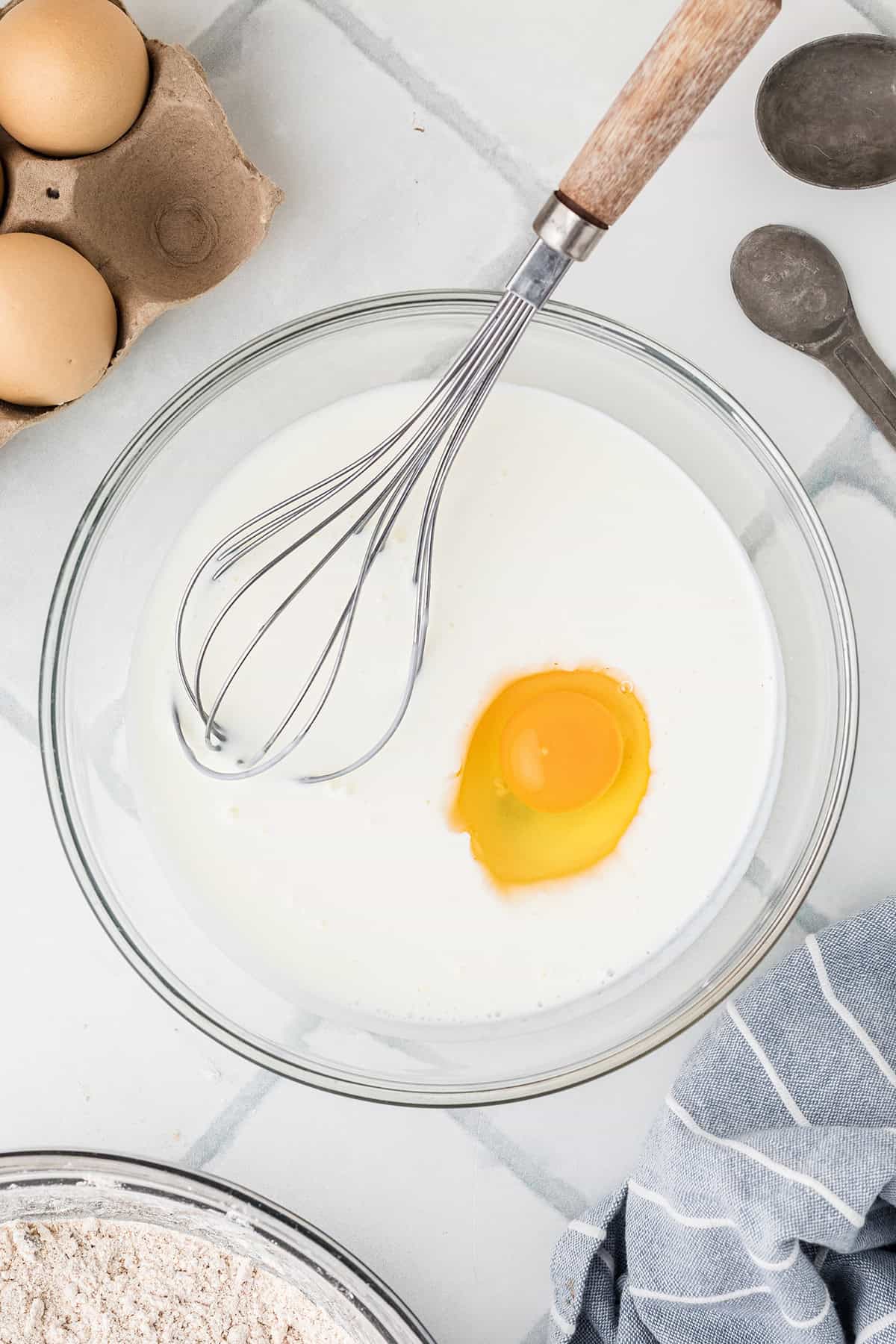 Buttermilk and egg in a mixing bowl.