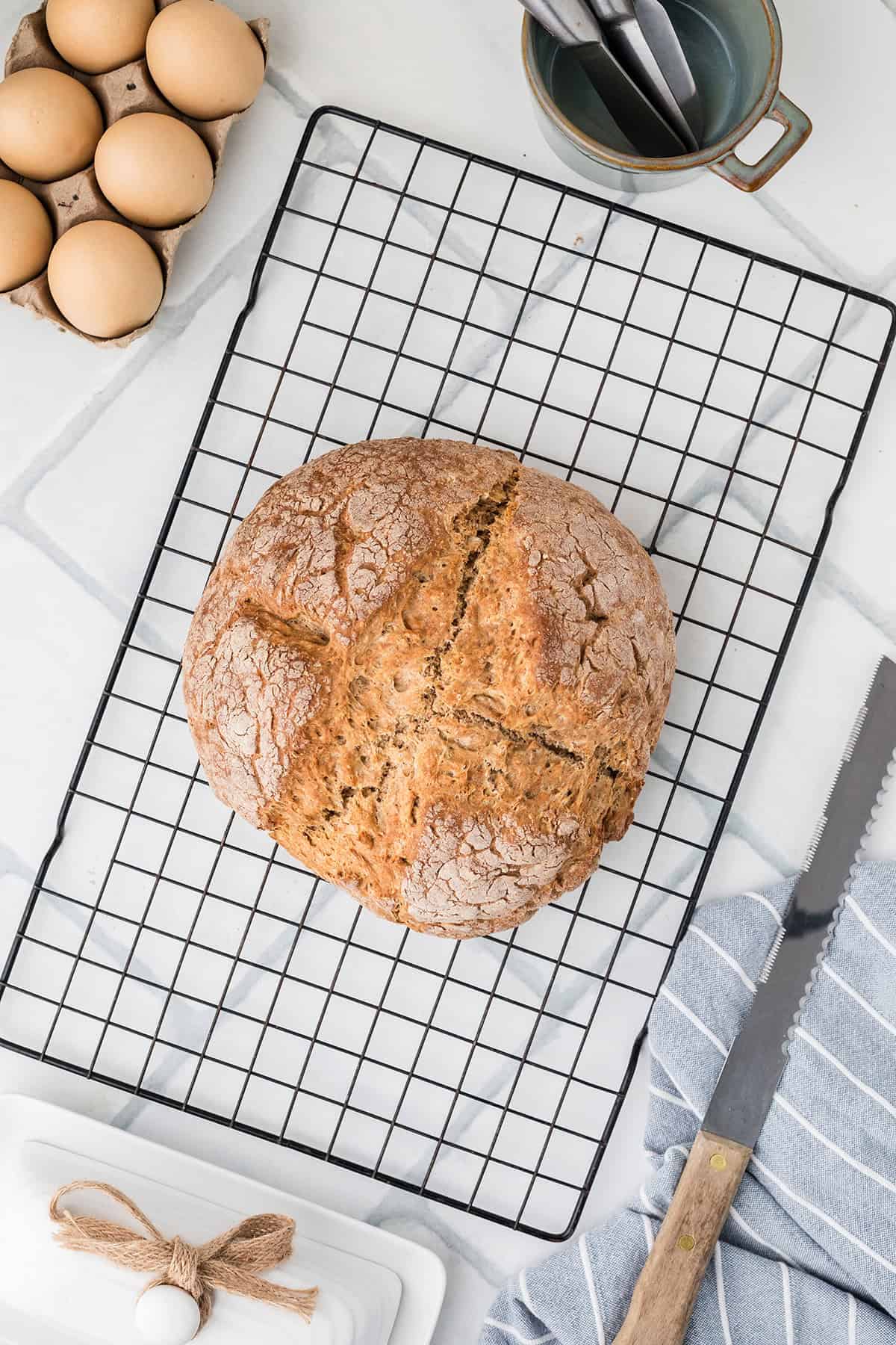 Baked bread cooling on a wire rack.