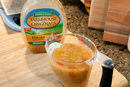 Salad dressing in a measuring cup.