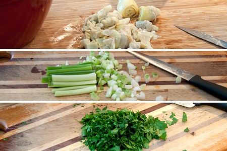 Prepping artichoke hearts, green onions, and fresh parsley.