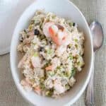 Shrimp and Rice Salad - a delicious supper salad with rice, shrimp, artichoke hearts, and black olives. https://www.lanascooking.com/shrimp-rice-salad