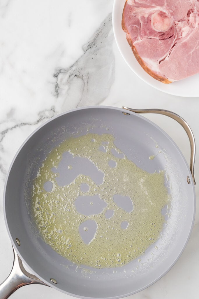 Melted butter in a skillet.