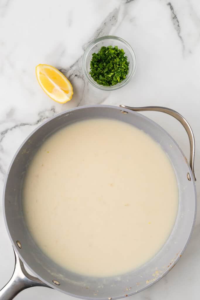 Milk and chicken broth added to the sauce.
