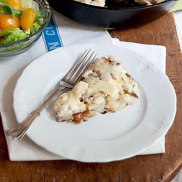 Hash Browns with Gruyere - Golden brown potatoes topped with sour cream and Gruyere cheese. https://www.lanascooking.com/hash-browns-gruyere/