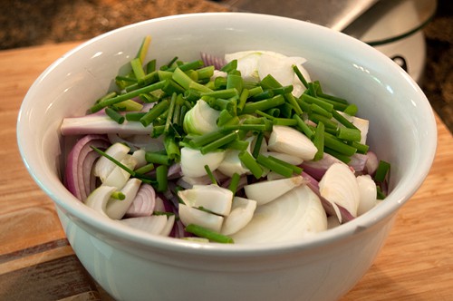 Prepared onions in a mixing bowl.