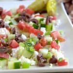 My Big Fat Greek Appetizer is layers of good olive oil, feta cheese, cucumber, green onion, tomatoes, and Kalamata olives. Scoop it up with a pita! https://www.lanascooking.com/big-fat-greek-appetizer