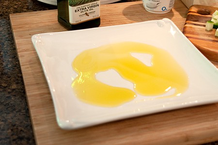 Serving platter with olive oil on the bottom.