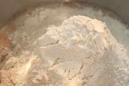 Bread dough ingredients in a bowl.