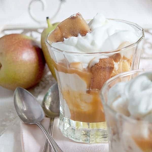 This Pear and Caramel Yogurt Trifle combines layers of pound cake with caramel yogurt, fresh pears, peanut brittle, and caramel sauce. https://www.lanascooking.com/pear-caramel-yogurt-trifle-recipe/