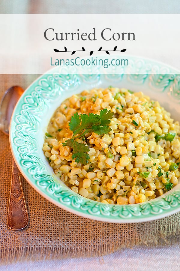 Finished curried corn in a vintage serving bowl.