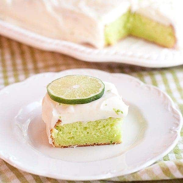 Lemon Lime Cake - boxed cake mix combined with jello makes a quick and easy citrusy dessert. https://www.lanascooking.com/lemon-lime-cake