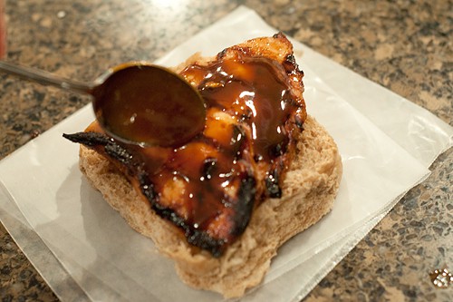 Adding reduced sauce to Asian Style Barbecue Chicken Sandwich