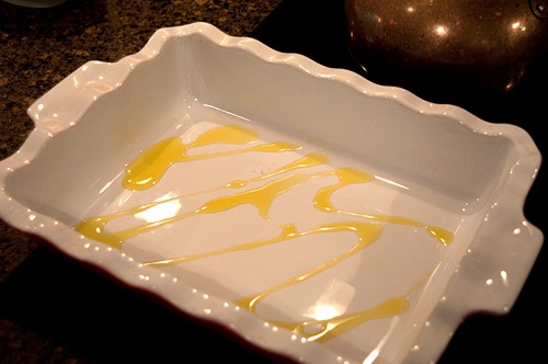 Baking dish with drizzled olive oil in the bottom.