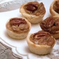 Pecan Tassies are a traditional southern holiday recipe. These two-bite mini pecan pies make a delicious addition to your dessert tray. https://www.lanascooking.com/pecan-tassies/