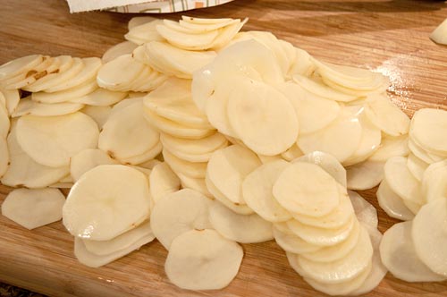 Slice potatoes for Potato Leek Bacon Au Gratin
