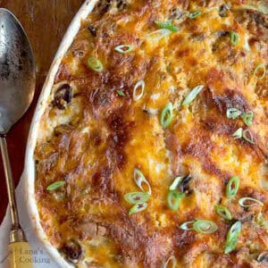 Finished breakfast strata in a white baking dish.