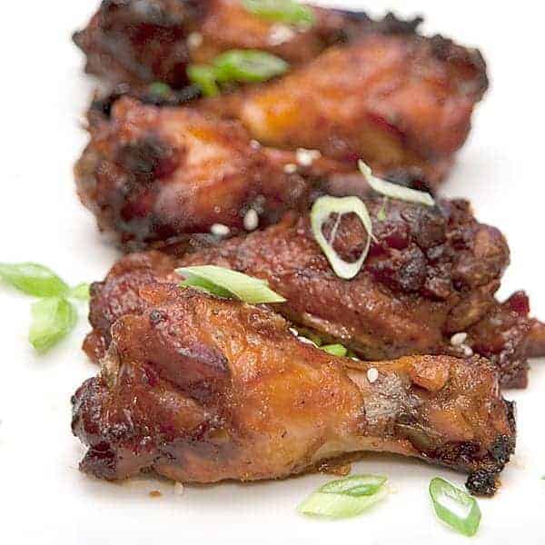 Slow Cooker Asian Style Wings with ginger, soy sauce, and Sriracha are a fantastic appetizer for any occasion from football party to apres ski. https://www.lanascooking.com/slow-cooker-asian-style-wings/