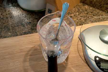 Soda water topping in a measuring cup.