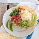 Layered Mexican Chicken Salad - a great main dish lunch or dinner salad featuring couscous and seasoned chicken with cheese, salsa, and cilantro. https://www.lanascooking.com/layered-mexican-chicken-salad/