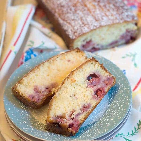 Lemon Raspberry Bread - a quick bread drenched with a lemon and sugar glaze is perfect for dessert, breakfast, or snack. Serve with tea or coffee. https://www.lanascooking.com/lemon-raspberry-bread/