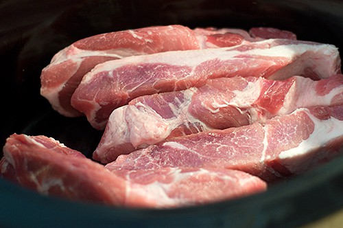 Pork ribs in a slow cooker.