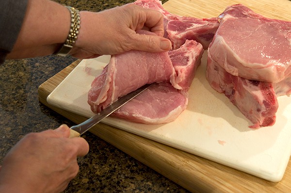 Create pocket for stuffing in each chop for Apple Pecan Stuffed Pork Chops