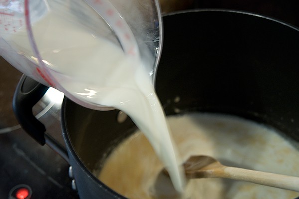 Adding milk to sauce for the casserole