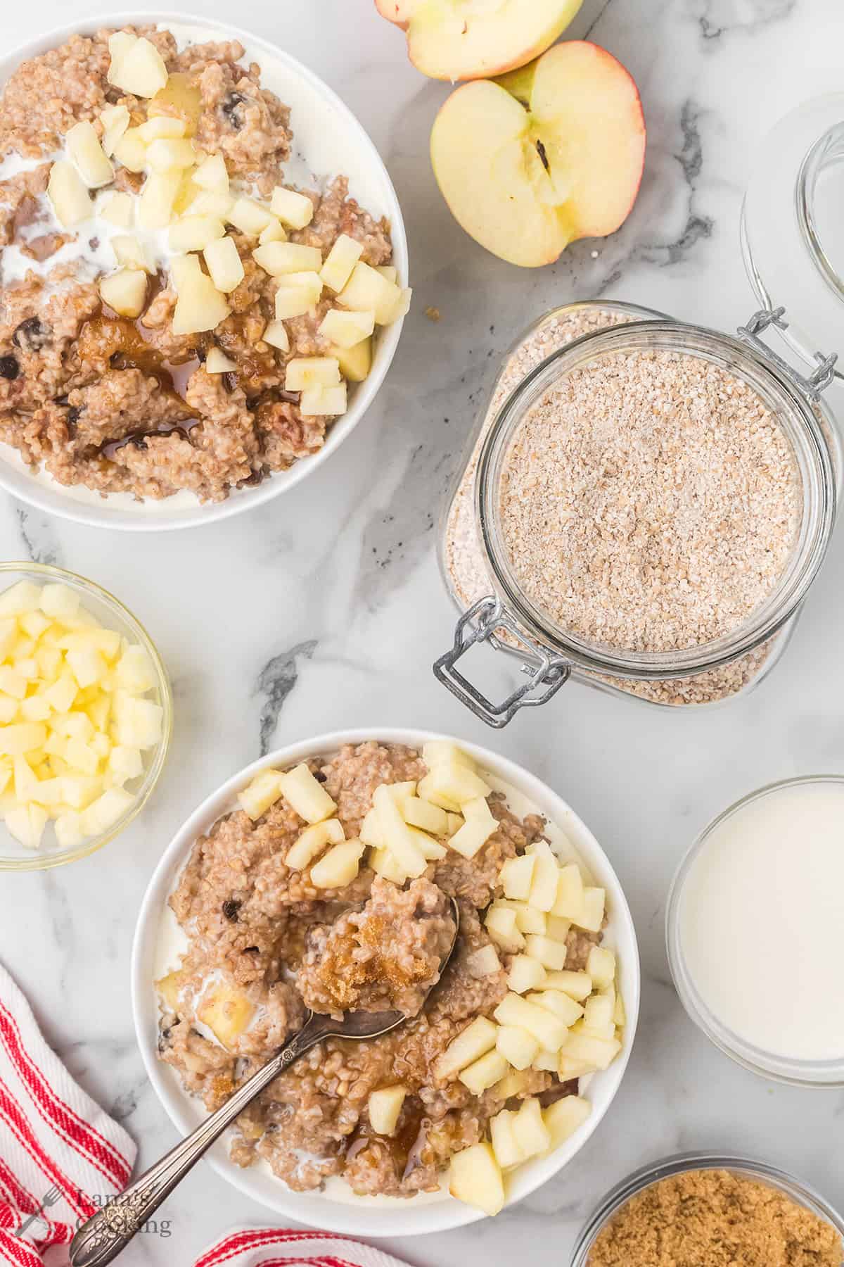 A serving of apple pie oatmeal in a white bowl.