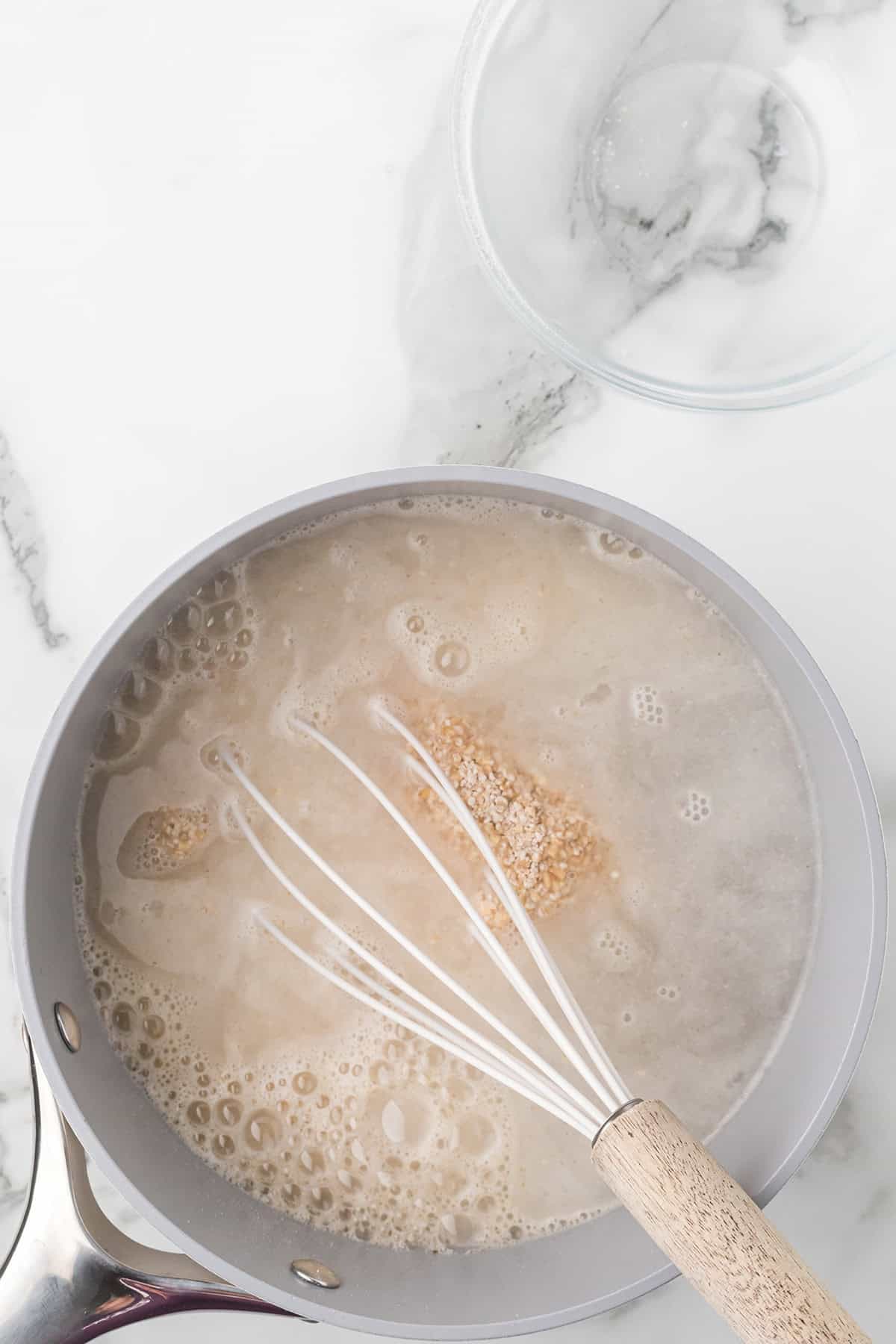 Oatmeal added to boiling water.