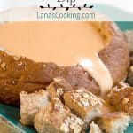 Beer and Three Cheese Dip - Beer combines with cheddar, cream cheese, and Romano in this luscious dip. Serve in a hollowed bread bowl with lots of dippers. https://www.lanascooking.com/beer-cheese-dip-bread bowl/