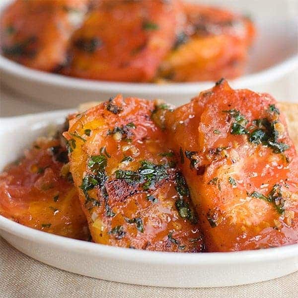 Fried Tomatoes with Garlic from @NevrEnoughThyme https://www.lanascooking.com/fried-tomatoes-with-garlic