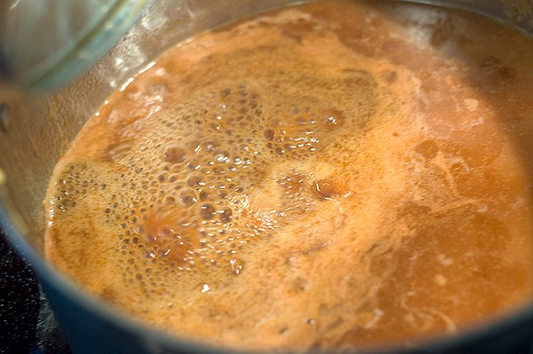 Sauce cooking over medium high heat.