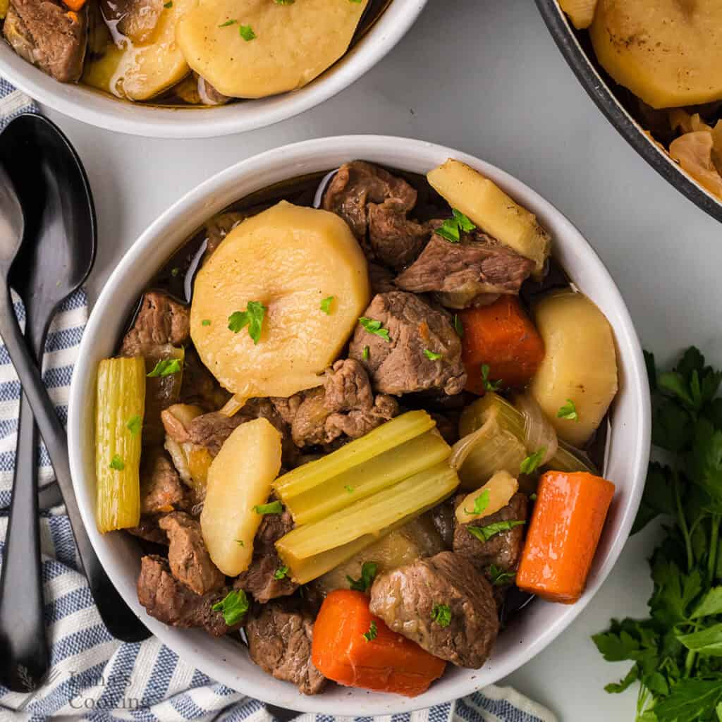 A serving if Irish Stew in a white bowl.