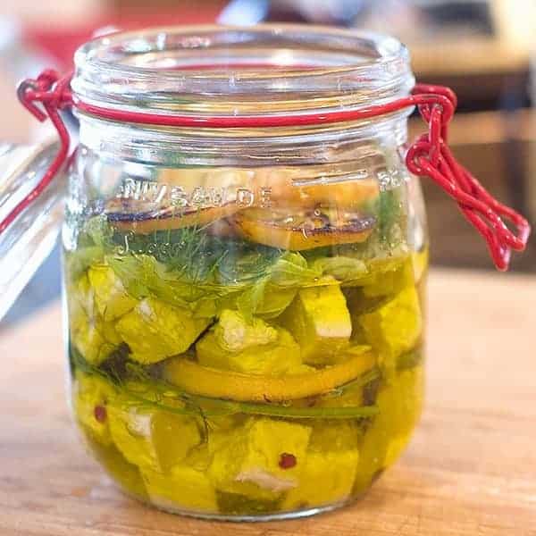 Marinated Feta with Roasted Lemon and Dill. Cubed feta marinated with olive oil, lemon, dill, and red pepper flakes. https://www.lanascooking.com/marinated-feta-roasted-lemon
