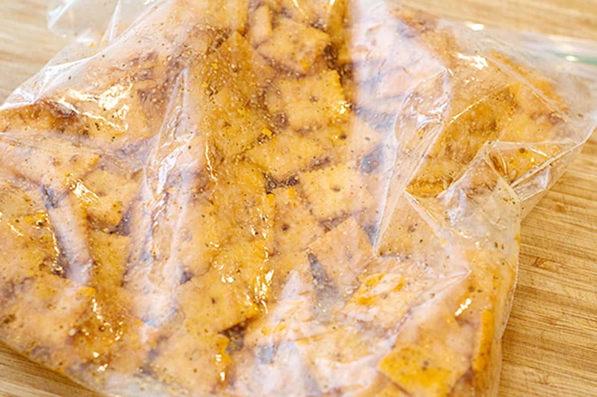 Crackers added to a bag with spices and butter.